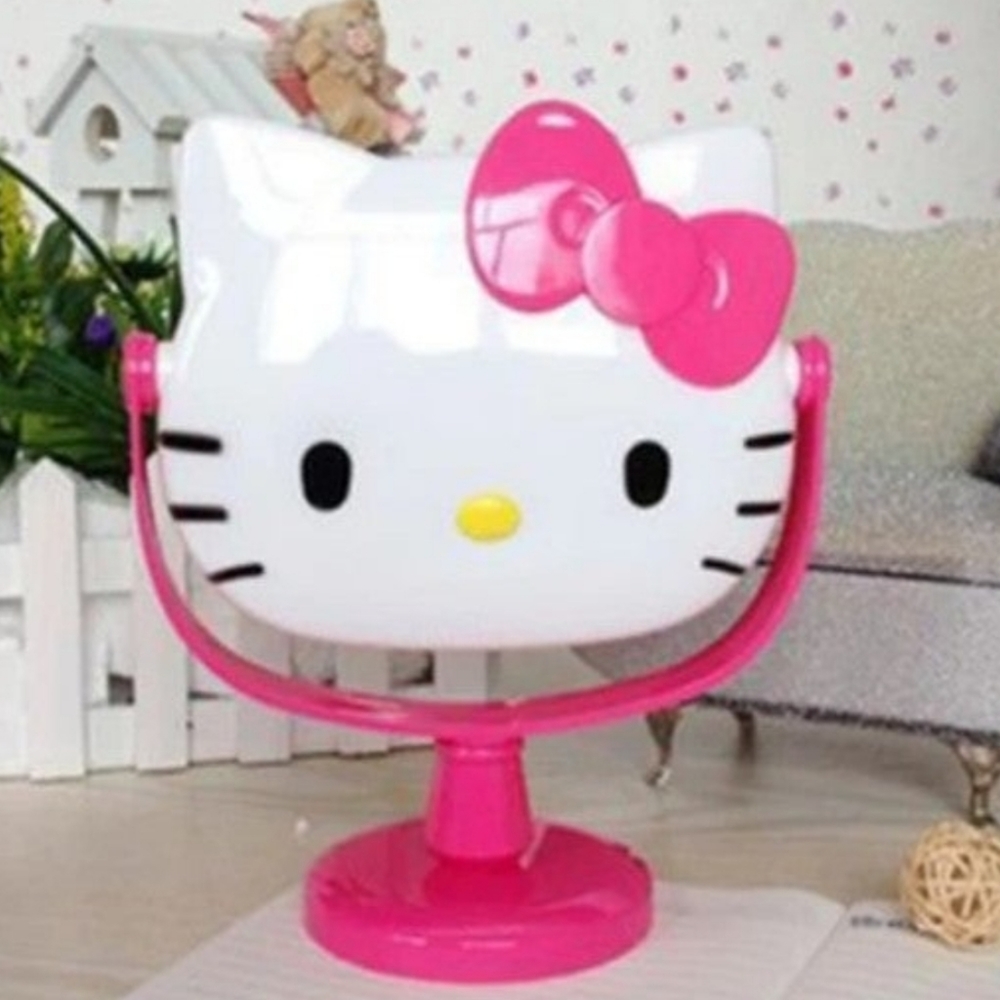 New Hello Kitty pink rotating makeup mirror approximately 9" tall.